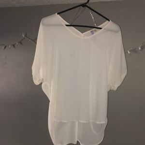Francesca’s sheer white blouse